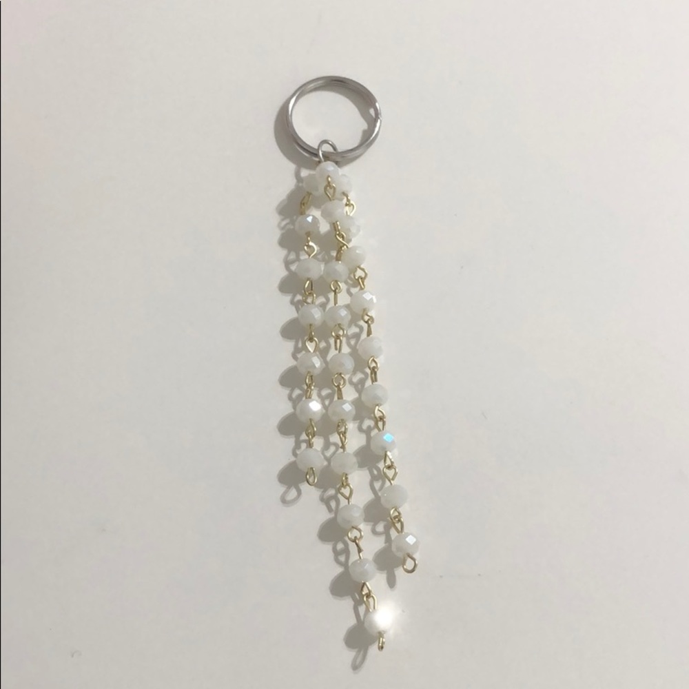White and gold key chain